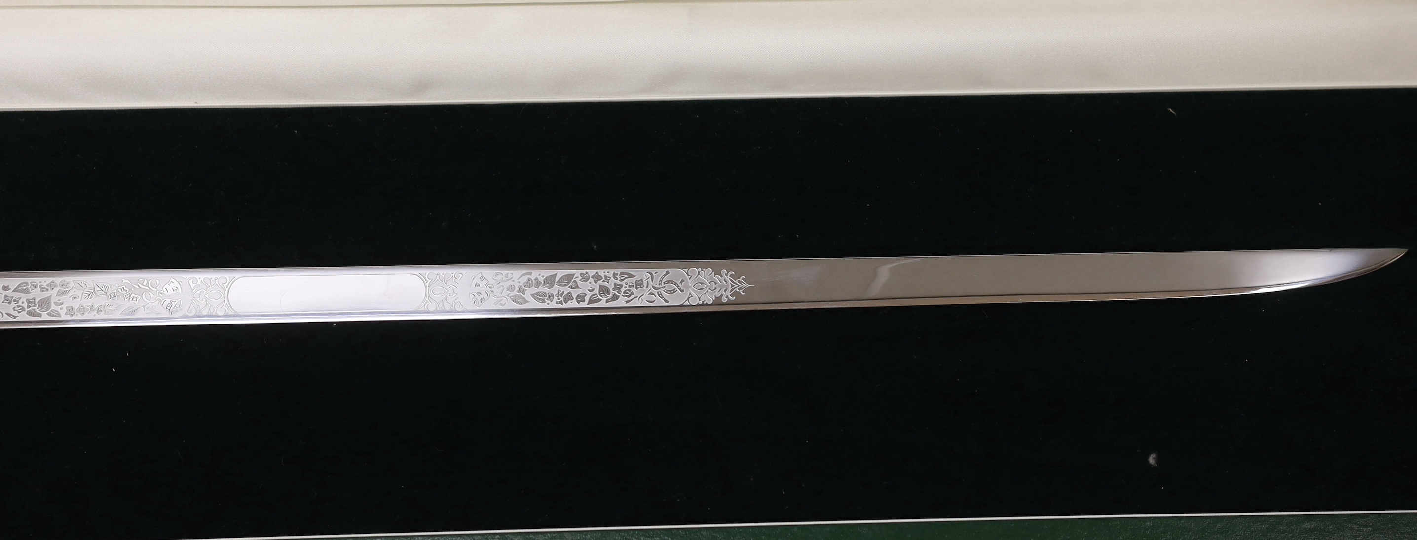 A Wilkinson presentation sword with etched blade, in Harrods case, blade 60cm